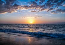 Bay Beach Destinations for Families beach at sunset, waves on shore