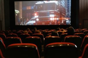 People in a movie theater watching a movie