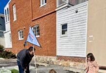 Children looking at a mini golf course made of ice