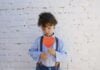 Boy holding a paper heart