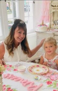 A mother and daughter at a fancy table