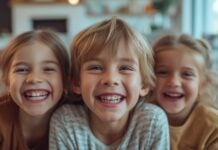 Portrait of happy siblings at home