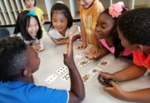 Kids doing card tricks