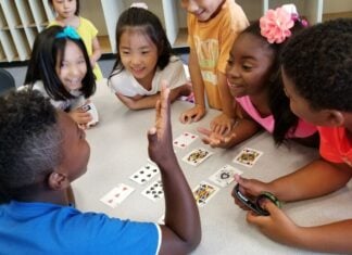 Kids doing card tricks