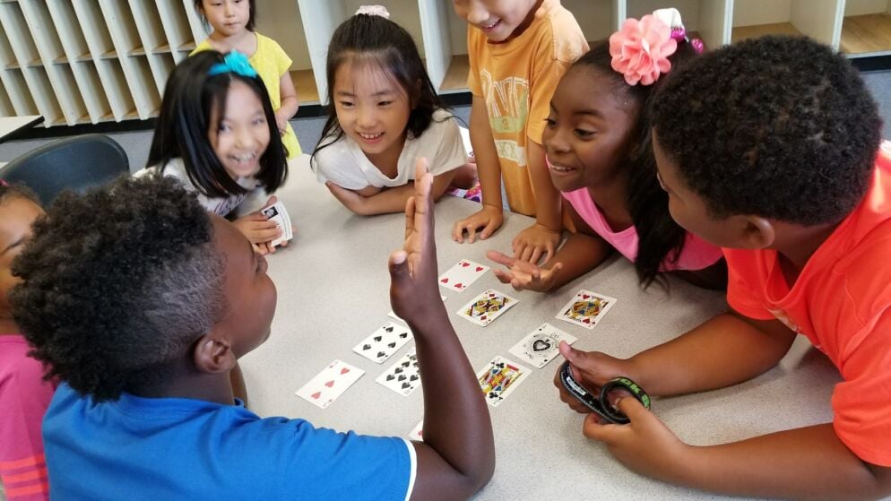 Kids doing card tricks