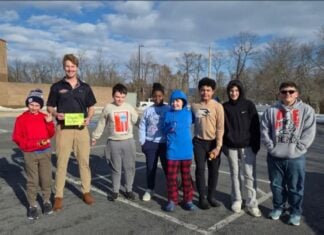 Kids standing outside a building