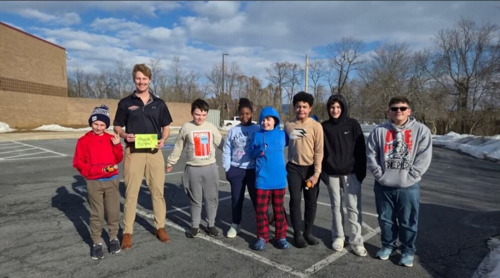 Kids standing outside a building