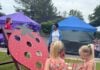 Explore These Frederick Events This Weekend: June 6-7 Two girls play a strawberry shaped beanbag toss at the strawberry festival
