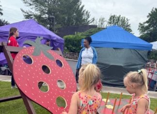 Explore These Frederick Events This Weekend: June 6-7 Two girls play a strawberry shaped beanbag toss at the strawberry festival