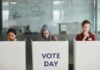 Three women at voting booths - the Maryland Gubernatorial Primary will occur June 2026