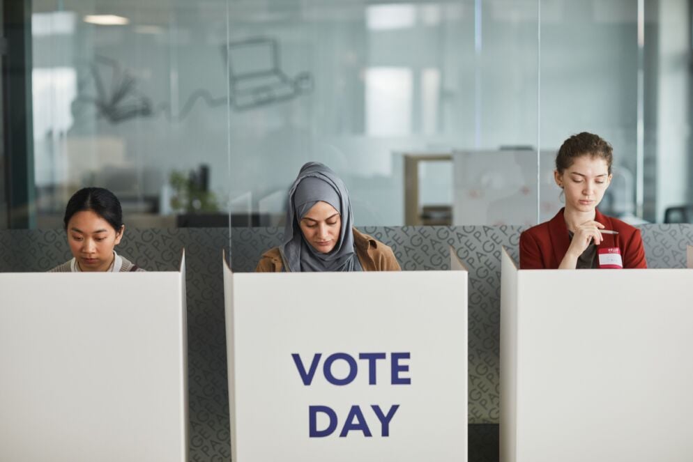Three women at voting booths - the Maryland Gubernatorial Primary will occur June 2026