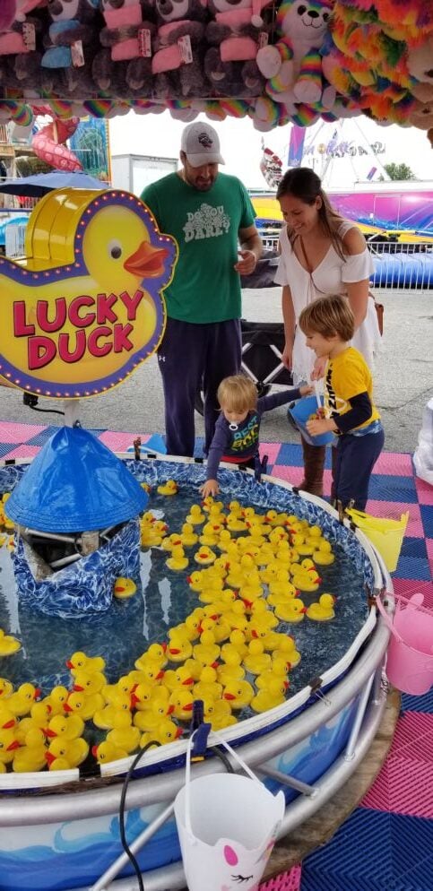 Kids gather round a duck game at the Maryland State Fair.