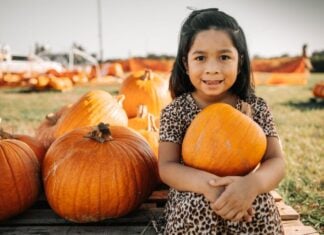 Fall Festival Fun in Frederick Girl holding pumpkin