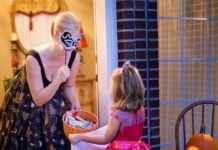 Weekend Fun in Frederick: Oct. 30-31 Young girl trick-or-treating at a woman's house
